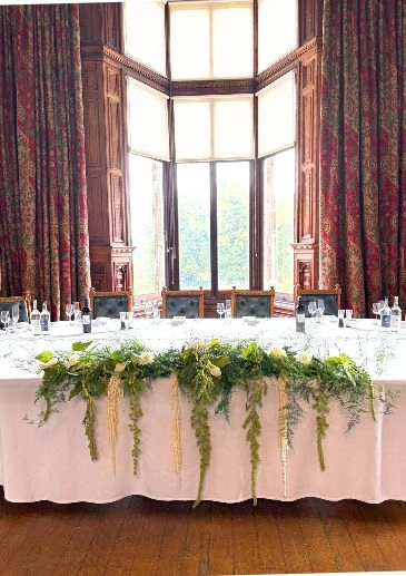 Knowsley hall wedding florist. Long top table with amaranthus